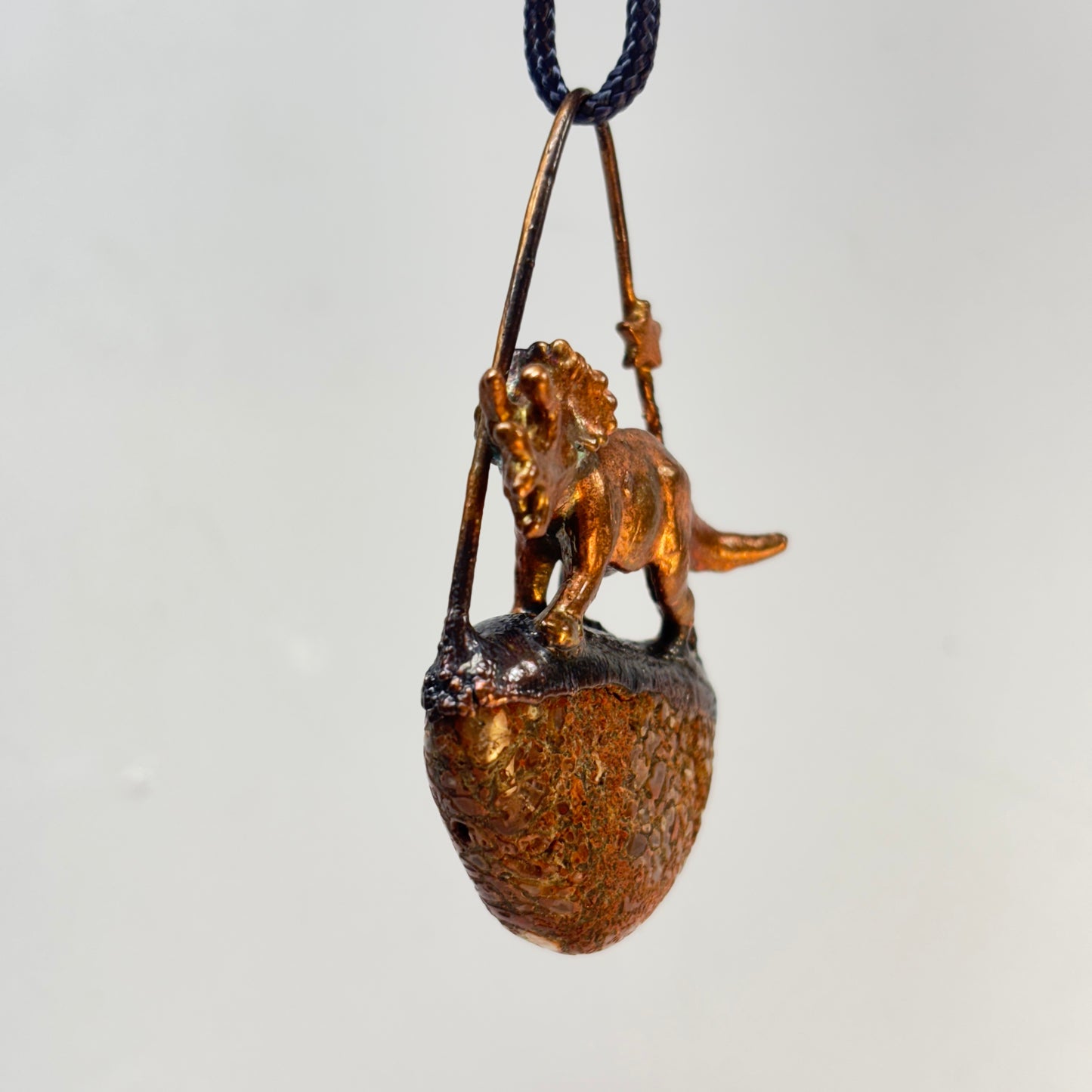 Dino on Dino! Petrified Dinosaur Bone Pendant with Triceratops