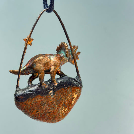 Dino on Dino! Petrified Dinosaur Bone Pendant with Triceratops