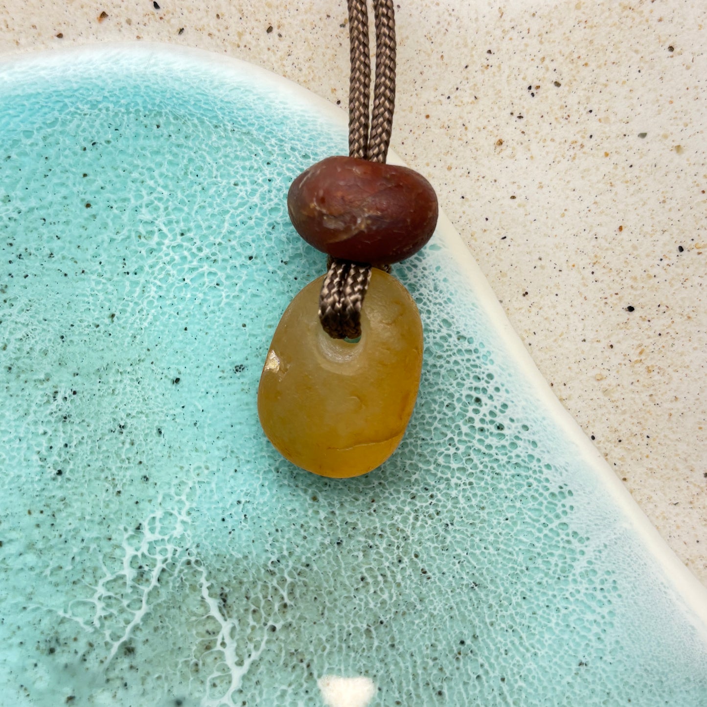 Beach Agate Hand Drilled Pendant with Red Jasper Crown Bead