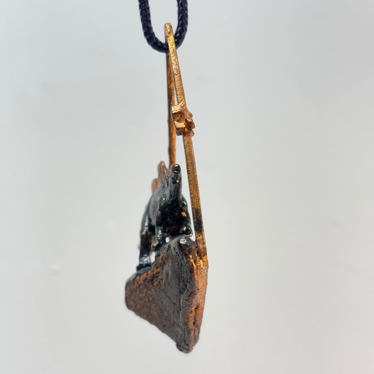 Dino on Dino! Petrified Dinosaur Bone Pendant with Stegasaurus
