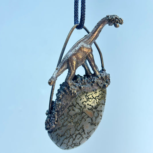 Dino on Dino! Petrified Dinosaur Bone Pendant with Sauropod